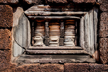 Window in a wall of Angkor What, with the typical columns