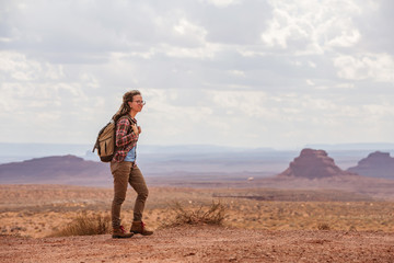 Fototapeta na wymiar Hiker in Valley of Gods, USA