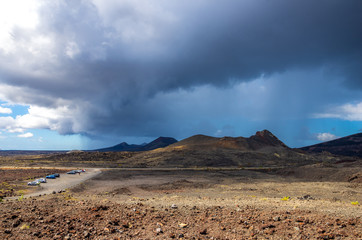 Landscape of a storm over the volcanoes of Timanvaya