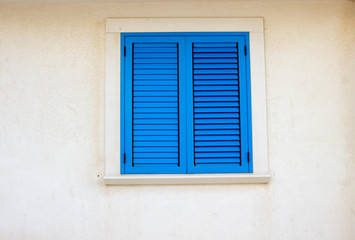 Blue window and white wall