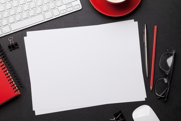 Office workplace table with blank paper page