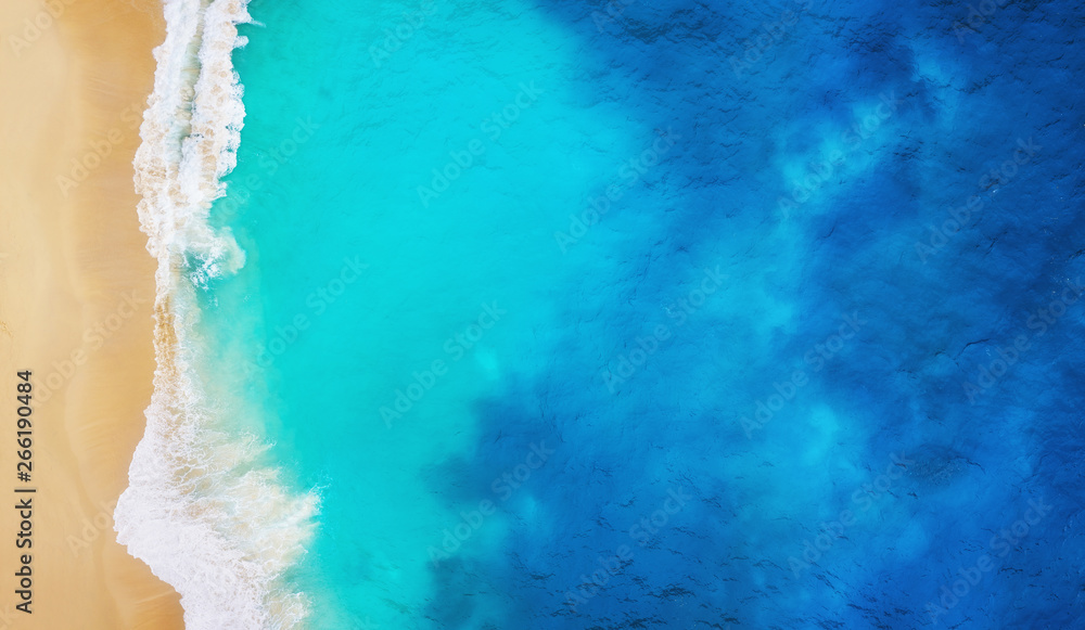 Wall mural coast as a background from top view. turquoise water background from top view. summer seascape from 