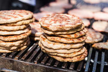Delicious grilled beef burger on barbecue outdoor