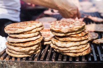 Delicious grilled beef burger on barbecue outdoor