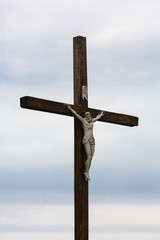 The image of a symbol of Jesus Christ on a wooden cross