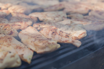 Grilled chicken meat on barbecue outdoor