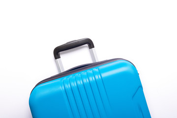 Blue suitcase on white background Creative Summer holidays, vacation, travel concept
