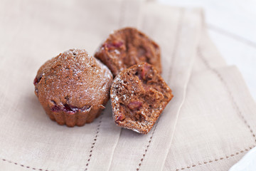 Chocolate muffins with ripe cherries