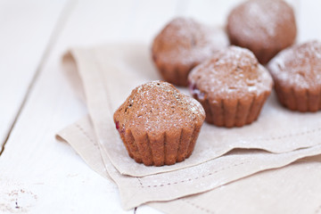 Chocolate muffins with ripe cherries