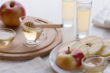 apple cider with honey on a table in a glass container