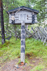 Wooden mailbox on the road 