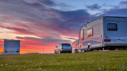 Camping caravans and cars  sunset - obrazy, fototapety, plakaty