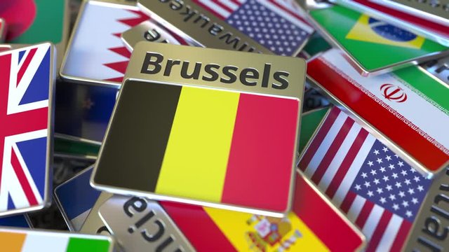 Souvenir magnet or badge with Brussels text and national flag among different ones. Traveling to Belgium conceptual intro animation