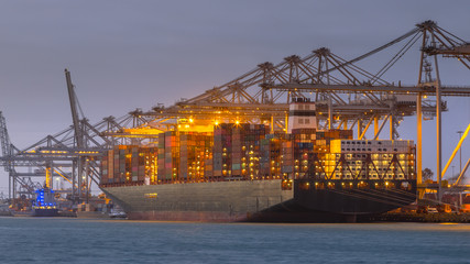 Cargo carrier ship at sunset