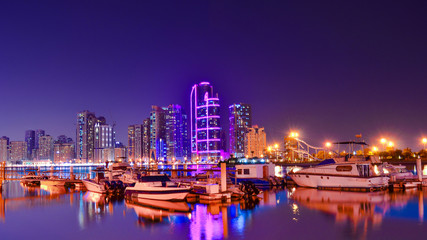Fototapeta na wymiar Beautiful night view of Buhaira corniche, Sharjah, United Arab Emirates