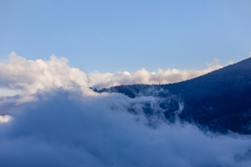 Fototapeta na wymiar Clouds over the valleys in Teide National Park, Tenerife
