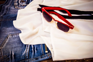 red-rimmed glasses and white shirt