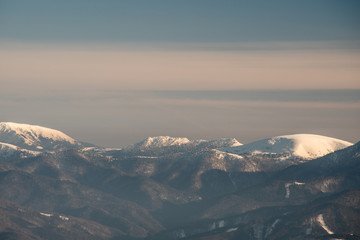 Rakytov, Cierrny kamena and Ploska in Velka Fatra mountains from Martinske hole in Mala Fatra mountains in Slovakia during winter