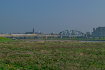 Dutch passenger train passing a bridge