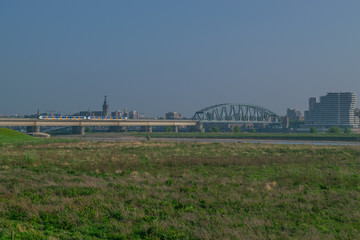 Dutch passenger train passing a bridge