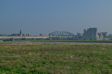 Dutch passenger train passing a bridge