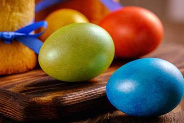 Easter cakes and colored eggs on a wooden table