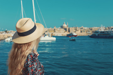 Tourist woman wondering in Malta at Sliema