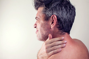 Man feels strong neck pain. People, healthcare and medicine concept
