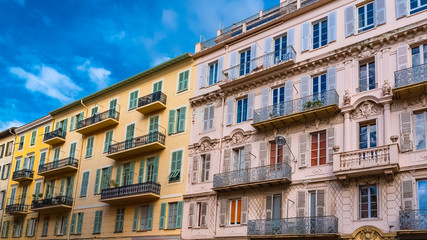 Fototapeta na wymiar Nice, France, colorful facade, with typical windows and shutters 