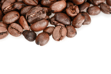 Brown roasted coffee beans, macro close up, isolated on a white background