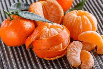 juicy mandarin on a gray wooden rustic background