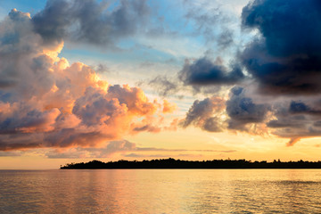 Sunrise dramatic sky on sea, tropical desert beach, no people, stormy clouds, travel destination, Indonesia Banyak Islands Sumatra