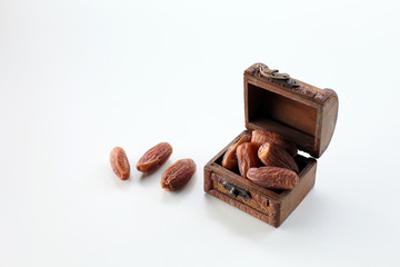 Creative layout made of dried date isolated on white background