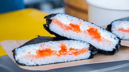 Outdoor cooking, gastronomy, asian food and service concept - Japanese sushi rolls at russian street food market festival