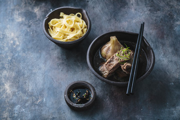 Bak kut teh or Tender pork ribs in herbal soup, asian cuisine, copy space
