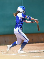High School Softball Players making plays during a game