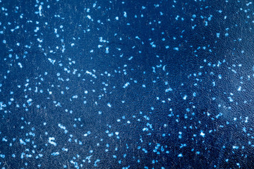 Weathered and scratched black and blue metal