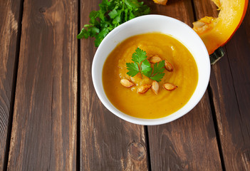 pumpkin soup on wooden surface