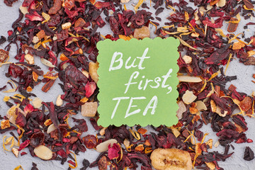 Karkade tea with fruits close up. Dry tea with fruits and petals. But first, TEA concept.