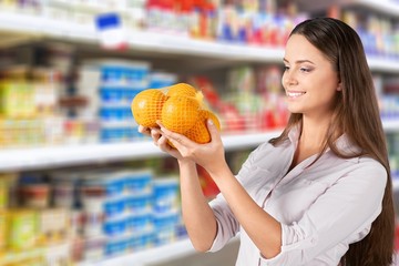 Woman in supermarket supermarket shopping groceries nutrition label women label