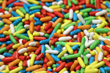 Colorful candy, selective focus. Red, green, blue, white and yellow sweets, pile of fruit candies for background