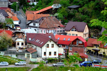 Fototapeta na wymiar Aerial view. Typical urban landscape of the city Brasov, a town situated in Transylvania, Romania, in the center of the country