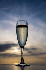 Champagne wine glass at sunset