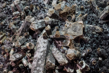 Raw cluster rough crystals close up in low light background