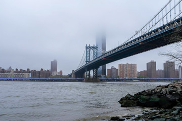 Fototapeta na wymiar Bridge on Foggy Day