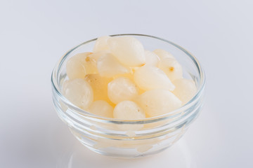 pickled vegetables on a white acrylic background