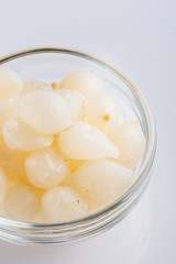 pickled vegetables on a white acrylic background