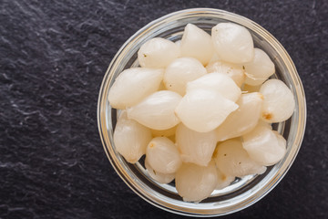 pickled vegetables on a dark stone background
