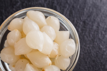 pickled vegetables on a dark stone background