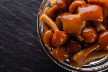 pickled vegetables on a dark stone background